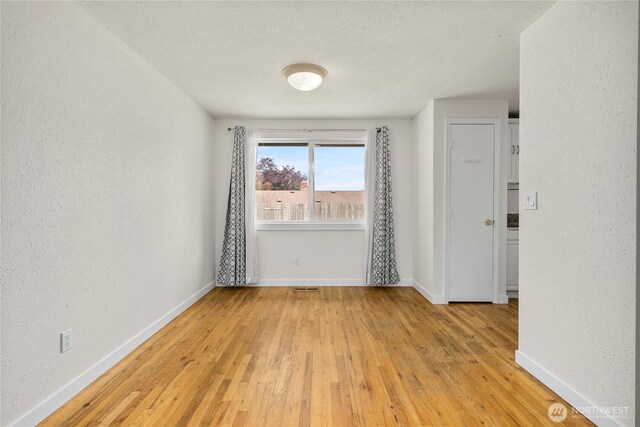 2530 SW 325th Pl, Federal Way, WA 98003 - empty room with light wood-style floors and a textured wall