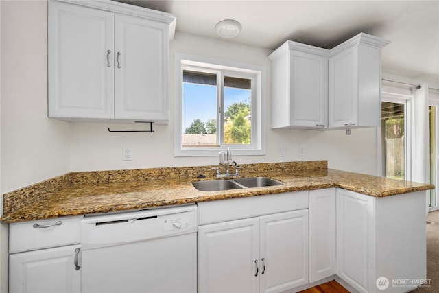 2530 SW 325th Pl, Federal Way, WA 98003 - kitchen featuring dishwasher, white cabinetry, dark stone countertops, and a peninsula