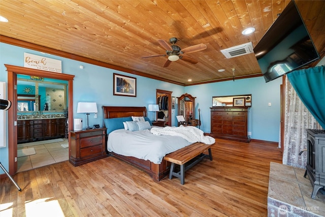 3151 Velvet Ln, Custer, WA 98240 - bedroom featuring a wood stove, light wood finished floors, ornamental molding, wood ceiling, and ensuite bathroom