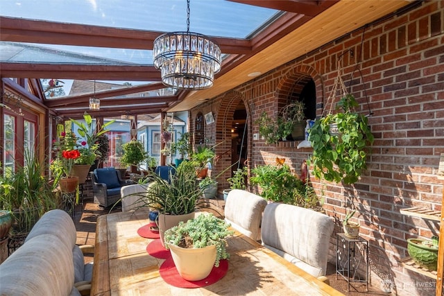 3151 Velvet Ln, Custer, WA 98240 - sunroom with brick wall and a chandelier