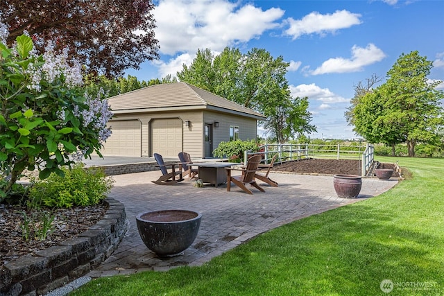 78718 Echols Rd, Hermiston, OR 97838 - view of patio featuring a fire pit, an outdoor structure, and a detached garage