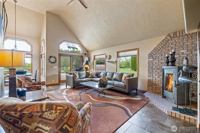 78718 Echols Rd, Hermiston, OR 97838 - living area with a textured ceiling, high vaulted ceiling, and a wood stove