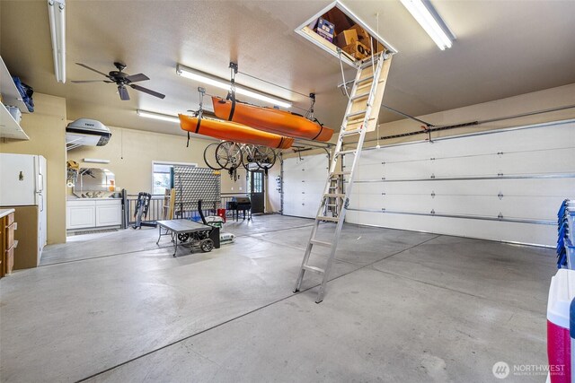 78718 Echols Rd, Hermiston, OR 97838 - garage featuring freestanding refrigerator and ceiling fan