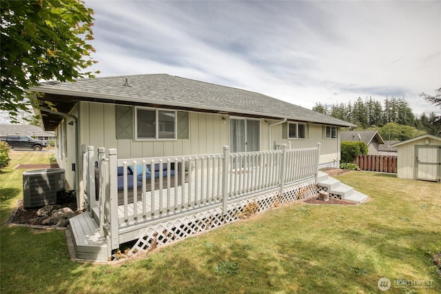 218 Holly Ln, Cosmopolis, WA 98537 - back of house featuring a storage unit, a wooden deck, and a shingled roof