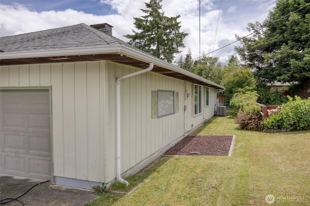 218 Holly Ln, Cosmopolis, WA 98537 - view of home's exterior with a chimney, a yard, and roof with shingles