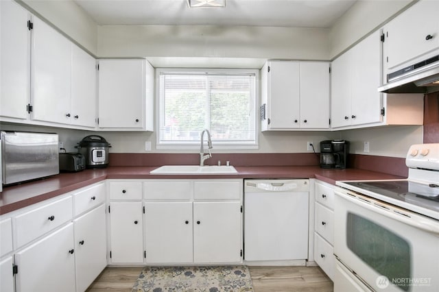218 Holly Ln, Cosmopolis, WA 98537 - kitchen featuring white appliances, light wood finished floors, white cabinetry, and extractor fan