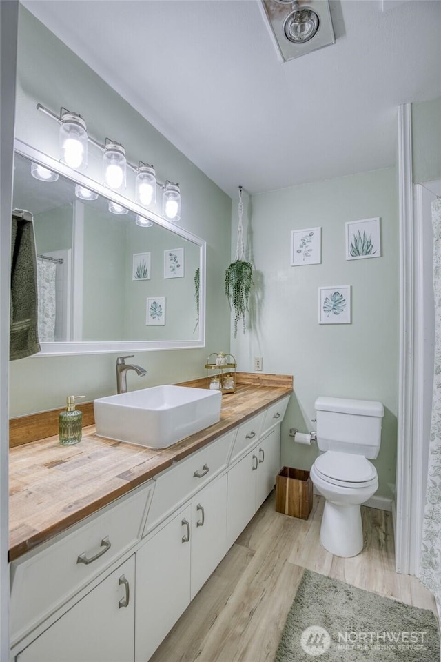 218 Holly Ln, Cosmopolis, WA 98537 - bathroom with vanity and wood finished floors