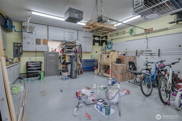 218 Holly Ln, Cosmopolis, WA 98537 - garage with electric panel, a workshop area, a garage door opener, and a heating unit
