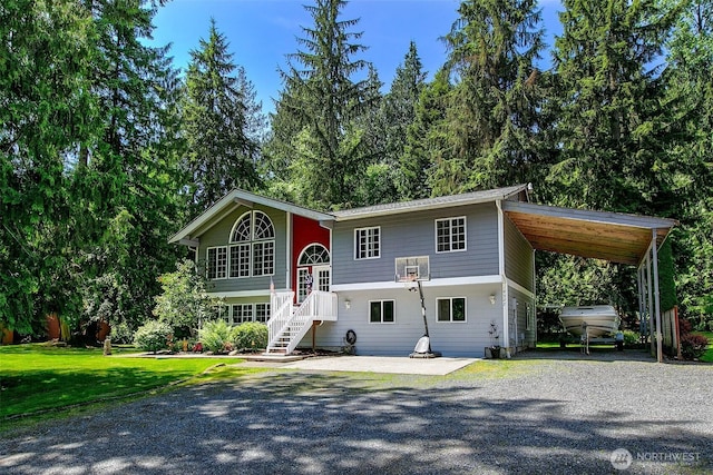 19322 Old Burn Rd, Arlington, WA 98223 - split foyer home with gravel driveway, a carport, and a front yard