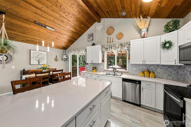 19322 Old Burn Rd, Arlington, WA 98223 - kitchen featuring appliances with stainless steel finishes, wood ceiling, decorative backsplash, white cabinets, and high vaulted ceiling