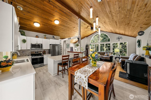 19322 Old Burn Rd, Arlington, WA 98223 - dining space with wood ceiling, a ceiling fan, and high vaulted ceiling