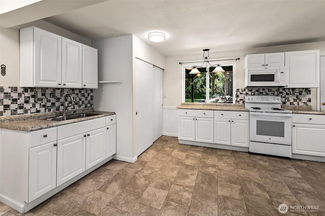 19322 Old Burn Rd, Arlington, WA 98223 - kitchen featuring white appliances, decorative backsplash, white cabinets, and stone finish flooring