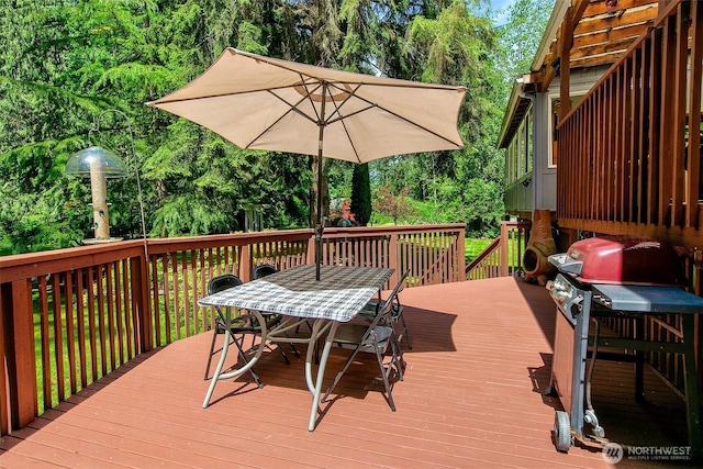 19322 Old Burn Rd, Arlington, WA 98223 - wooden terrace with outdoor dining space and view of wooded area