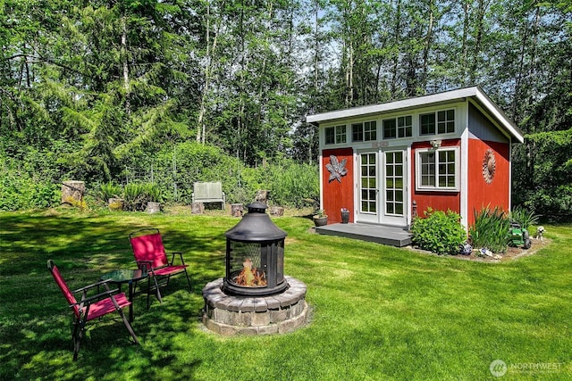 19322 Old Burn Rd, Arlington, WA 98223 - view of outdoor structure featuring an outdoor fire pit