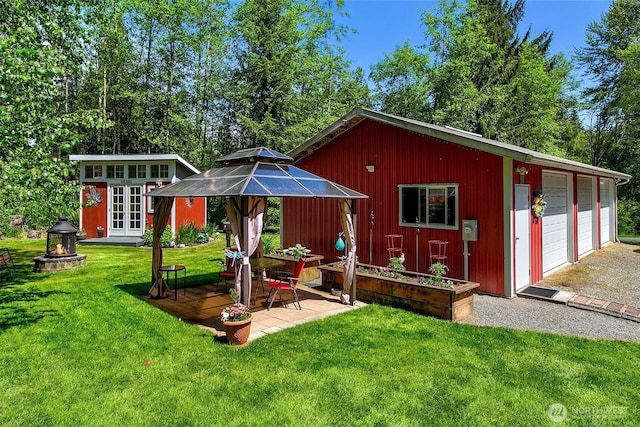 19322 Old Burn Rd, Arlington, WA 98223 - rear view of property featuring an outbuilding, a yard, a garage, and a gazebo