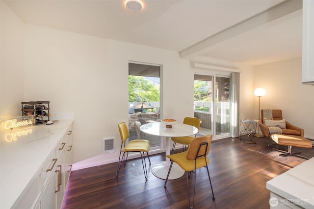 812 100th Ave NE Unit 102, Bellevue, WA 98004 - dining space with dark wood-type flooring and baseboards