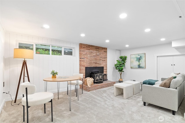 12023 35th Ave NE, Seattle, WA 98125 - living area featuring a wood stove, recessed lighting, and light colored carpet