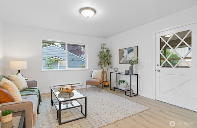 12023 35th Ave NE, Seattle, WA 98125 - living area featuring a baseboard radiator and wood finished floors