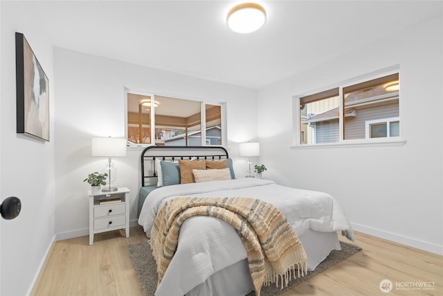 12023 35th Ave NE, Seattle, WA 98125 - bedroom featuring wood finished floors and multiple windows