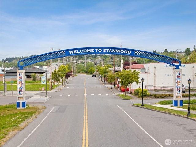 7404 281st St NW Unit 59, Stanwood, WA 98292 - view of asphalt street with curbs, sidewalks, and street lighting