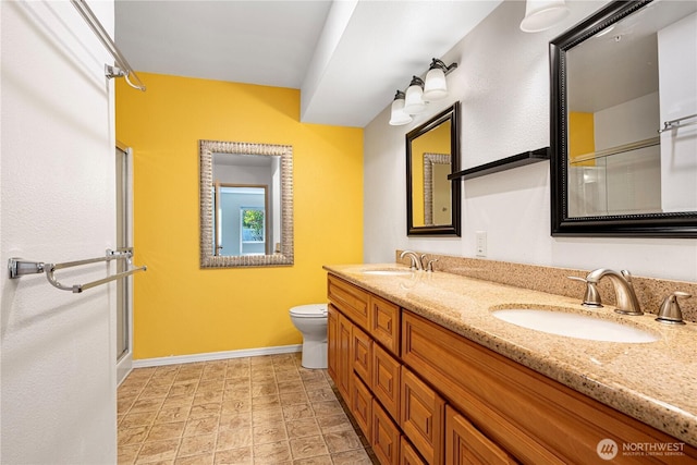 11130 SE 208th St Unit K101, Kent, WA 98031 - bathroom with double vanity and a shower with shower door