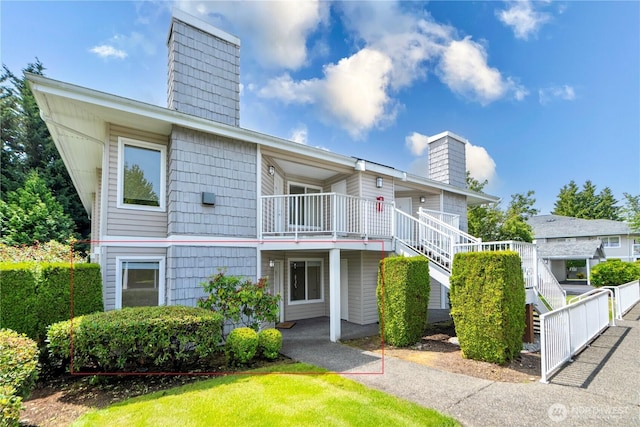 11130 SE 208th St Unit K101, Kent, WA 98031 - view of building exterior featuring stairs