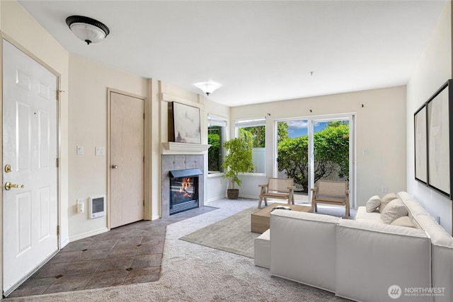 11130 SE 208th St Unit K101, Kent, WA 98031 - living room featuring a tile fireplace and baseboards