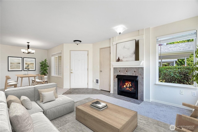 11130 SE 208th St Unit K101, Kent, WA 98031 - living room featuring a chandelier, carpet flooring, and a fireplace
