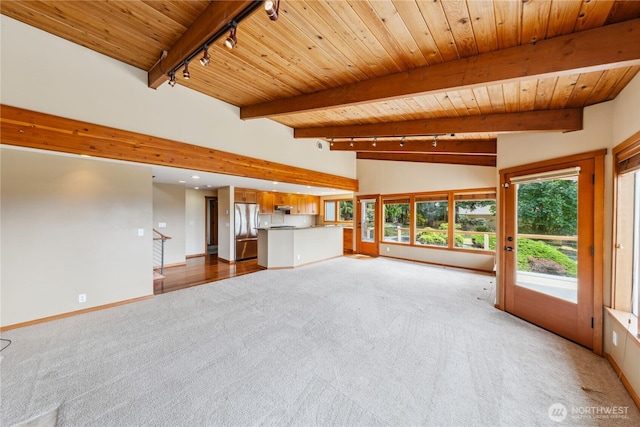 705 Shelter Bay Dr, La Conner, WA 98257 - unfurnished living room with track lighting, light colored carpet, wooden ceiling, and recessed lighting