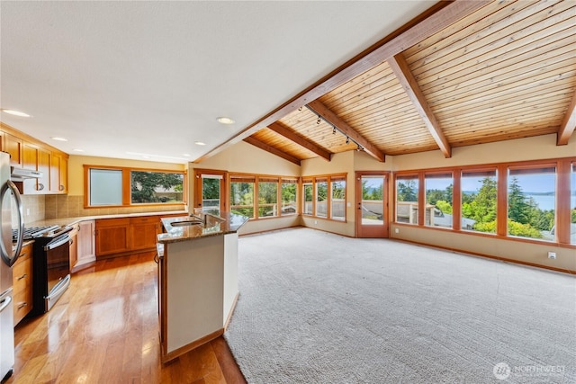 705 Shelter Bay Dr, La Conner, WA 98257 - kitchen with stainless steel appliances, plenty of natural light, open floor plan, decorative backsplash, and recessed lighting