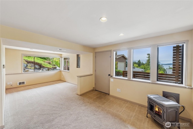 705 Shelter Bay Dr, La Conner, WA 98257 - spare room with a wood stove, recessed lighting, and carpet floors