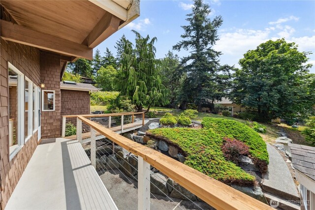 705 Shelter Bay Dr, La Conner, WA 98257 - wooden deck featuring view of scattered trees