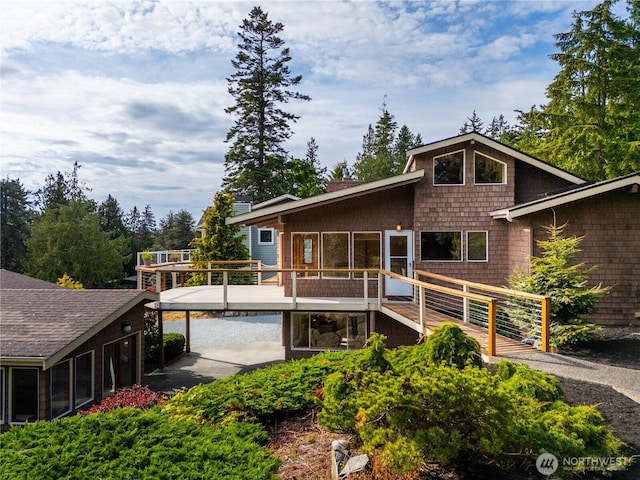 705 Shelter Bay Dr, La Conner, WA 98257 - back of property with a deck and a sunroom