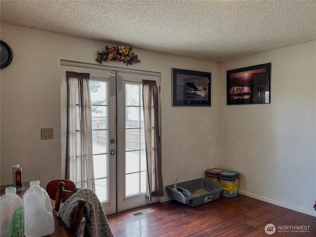 351N Grape, Moses Lake, WA 98837 - doorway to outside with a textured ceiling, wood finished floors, and french doors