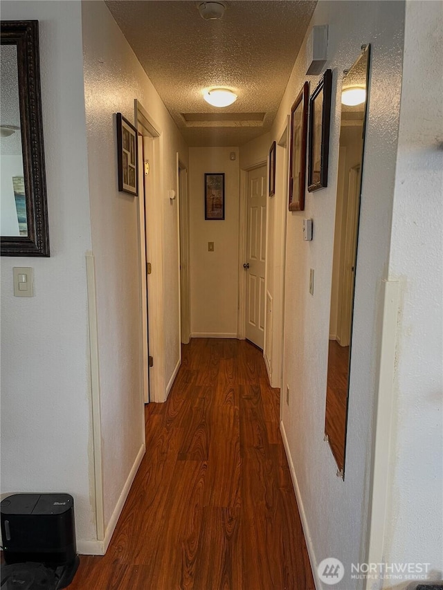 351N Grape, Moses Lake, WA 98837 - corridor featuring dark wood-style flooring and a textured ceiling