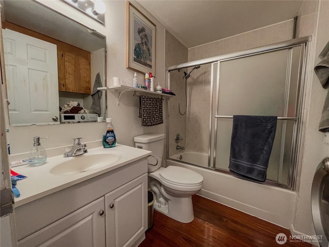 351N Grape, Moses Lake, WA 98837 - full bath featuring vanity, wood finished floors, and shower / bath combination with glass door