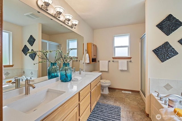 817 Darwins Way, Granite Falls, WA 98252 - full bathroom with healthy amount of natural light, a stall shower, double vanity, and a garden tub