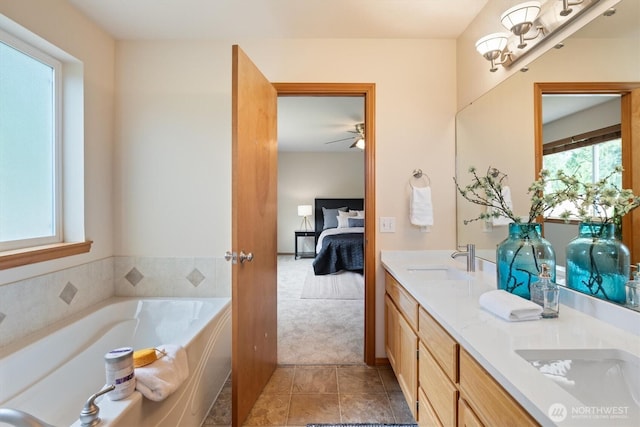 817 Darwins Way, Granite Falls, WA 98252 - bathroom with connected bathroom, double vanity, a garden tub, tile patterned flooring, and ceiling fan