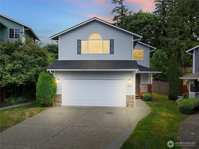 817 Darwins Way, Granite Falls, WA 98252 - traditional-style home with stone siding, concrete driveway, a garage, and roof with shingles