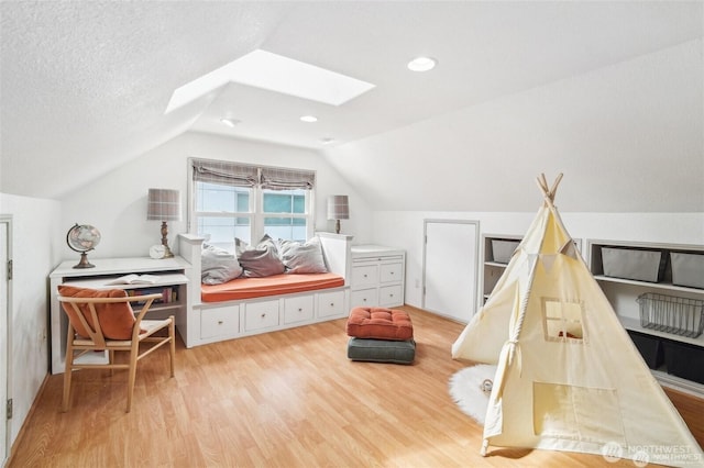 603 NW 52nd St, Seattle, WA 98107 - bedroom with light wood-style flooring, a skylight, and vaulted ceiling