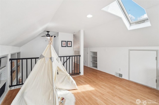 603 NW 52nd St, Seattle, WA 98107 - additional living space featuring a skylight, wood finished floors, lofted ceiling, and ceiling fan