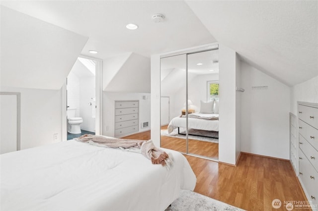 603 NW 52nd St, Seattle, WA 98107 - bedroom featuring lofted ceiling, light wood-style floors, a closet, ensuite bathroom, and recessed lighting