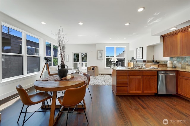 2063 13th Ave W, Seattle, WA 98119 - kitchen with stainless steel dishwasher, brown cabinets, a peninsula, recessed lighting, and dark wood-style floors
