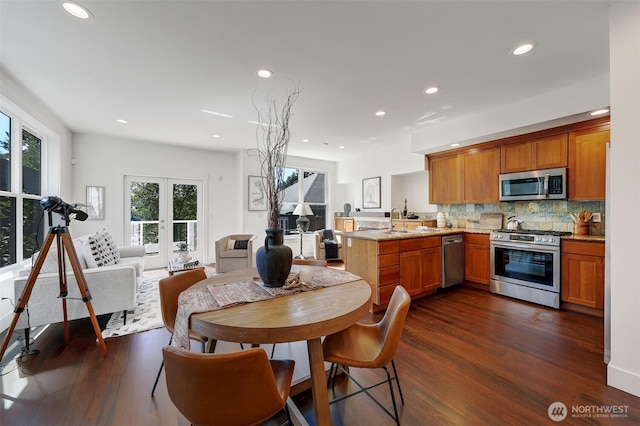 2063 13th Ave W, Seattle, WA 98119 - dining room featuring dark wood finished floors, recessed lighting, and french doors