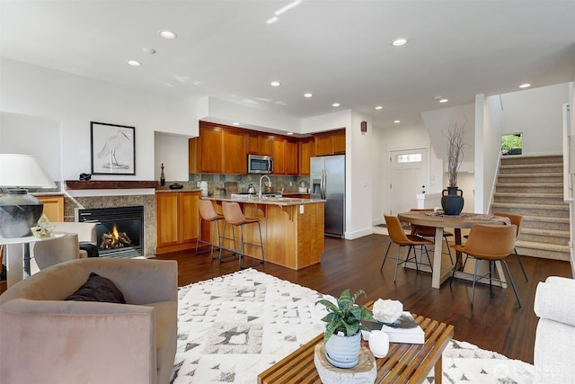 2063 13th Ave W, Seattle, WA 98119 - living room featuring dark wood-style flooring, stairway, recessed lighting, and a fireplace