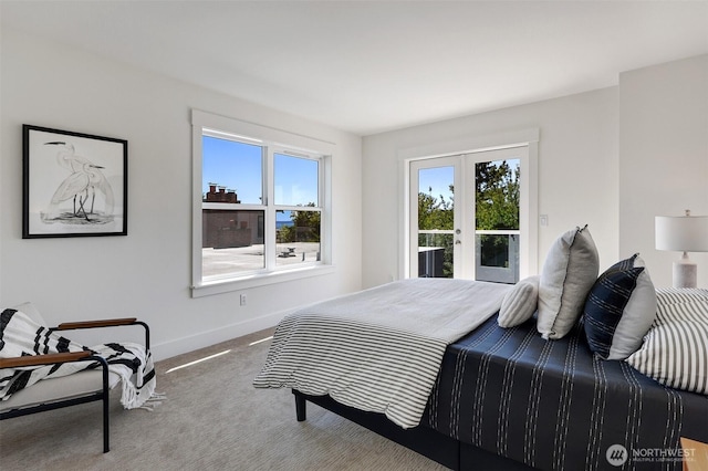 2063 13th Ave W, Seattle, WA 98119 - bedroom featuring access to exterior, french doors, and carpet