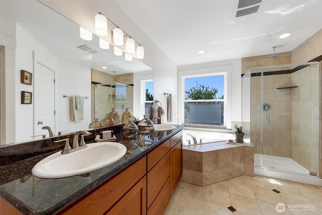2063 13th Ave W, Seattle, WA 98119 - bathroom featuring a shower stall, double vanity, a garden tub, and tile patterned floors