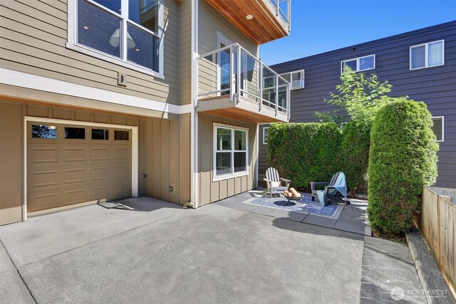 2063 13th Ave W, Seattle, WA 98119 - patio / terrace featuring concrete driveway, a garage, and a patio area