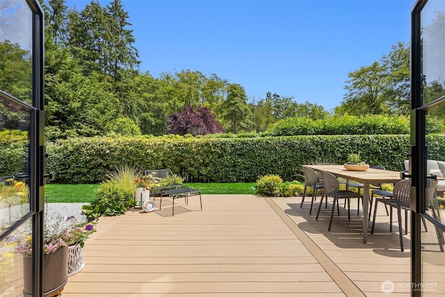 10430 NE Cascade St, Bainbridge Island, WA 98110 - wooden terrace featuring a fenced backyard and outdoor dining area