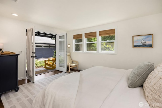 10430 NE Cascade St, Bainbridge Island, WA 98110 - bedroom featuring access to exterior, multiple windows, wood finished floors, and recessed lighting